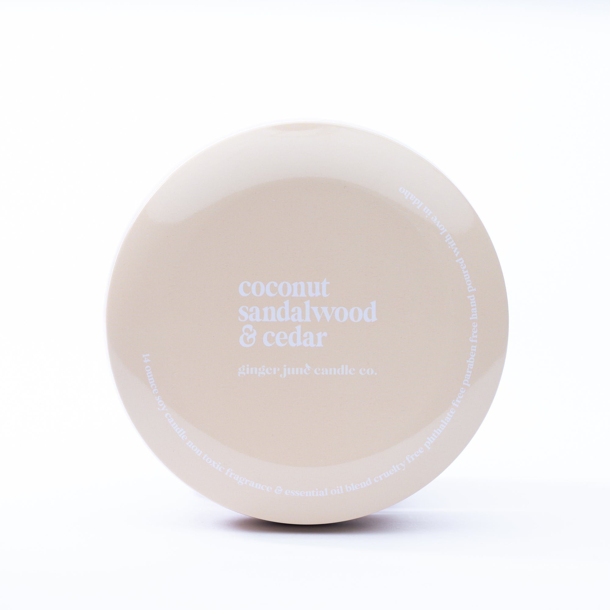 nude tin: coconut sandalwood + cedar  14 oz candle